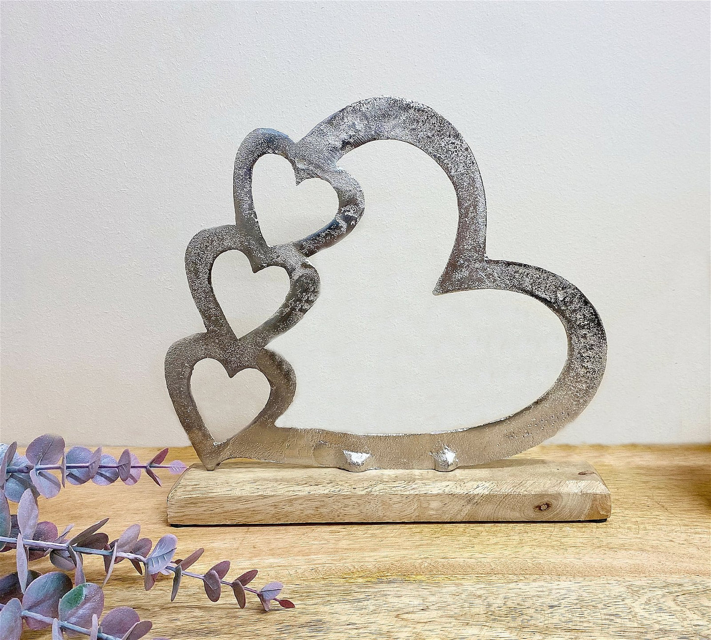 Metal Silver Four Heart Ornament On A Wooden Base Medium